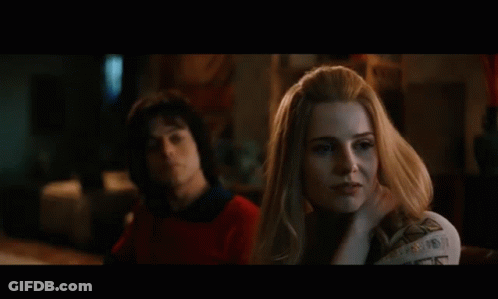 Couple Sitting, Woman Gazing At Man GIF