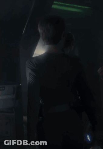 Couple Standing In Dark Room With Green Light GIF