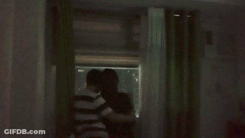 Couple Standing In Front Of Green Curtain GIF