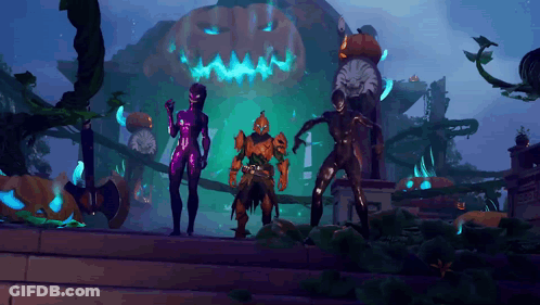 Couple Standing In Front Of Pumpkin GIF