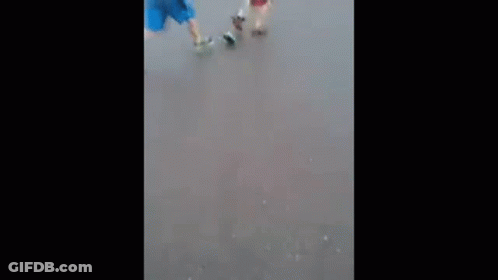 Couple Walking Down Street In Rain GIF