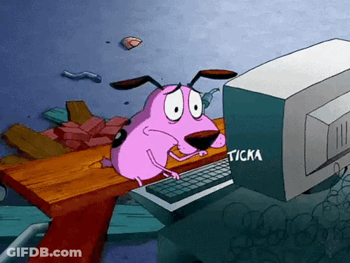 Courage The Cowardly Dog Is Sitting At A Desk Looking At A Computer Screen GIF