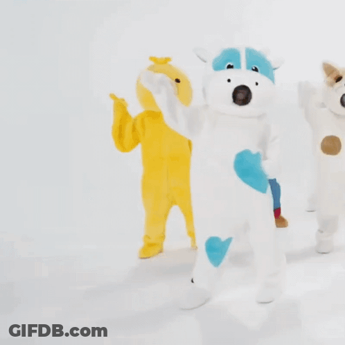 Cow And Dog Stuffed Animals In Line GIF
