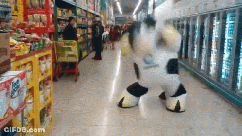 Cow Mascot Dancing In Grocery Store GIF