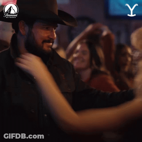 Cowboy Hat Man Dancing With Woman In Paramount Ad GIF
