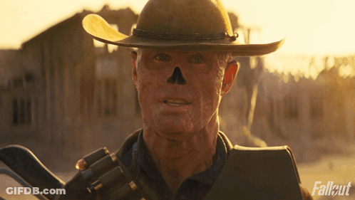 Cowboy Hat Man Holding Gun Fallout GIF