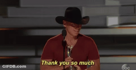 Cowboy Hat Man Holding Trophy Saying Thank You GIF