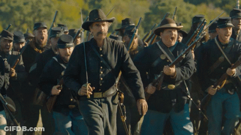 Cowboy Hat Man Leading Soldiers With Guns GIF