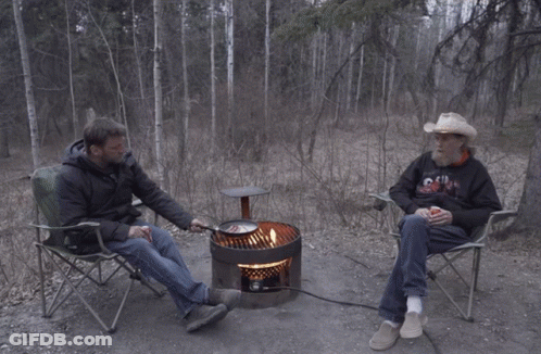 Cowboy Hat Man Next To Man In Chill Hoodie GIF