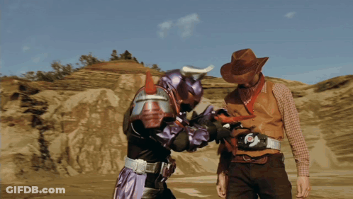 Cowboy Hat Man Next To Purple Superhero GIF