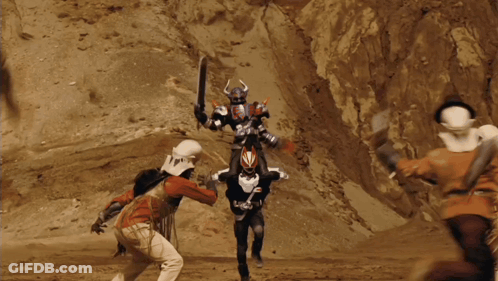 Cowboy Hat Man Next To Robot Suit Man GIF