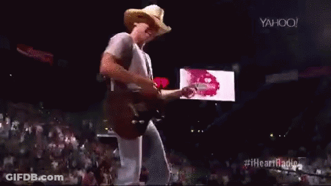 Cowboy Hat Man Playing Guitar On Stage GIF