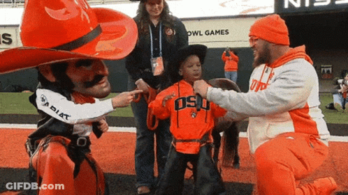 Cowboy Hat Man Pointing At Child In Osu Shirt GIF