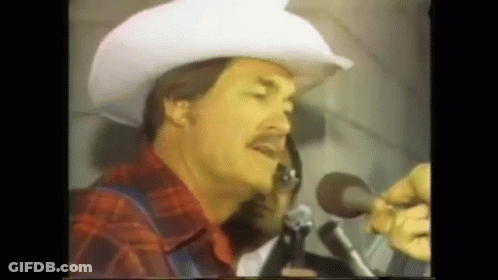 Cowboy Hat Man Singing Into Microphone GIF