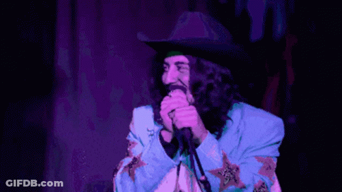 Cowboy Hat Man Singing Into Microphone With Peanut Butter GIF