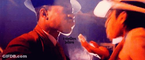 Cowboy Hat Man Smoking Next To Man In Suit GIF