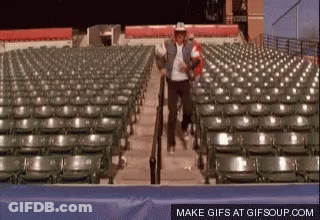 Cowboy Hat Man Walking Down Stadium Stairs GIF