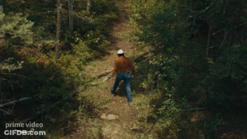 Cowboy Hat Man Walking On Prime Video Path GIF