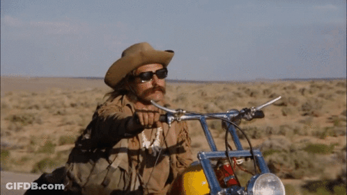 Cowboy Hat Sunglasses Man Riding Motorcycle Desert GIF