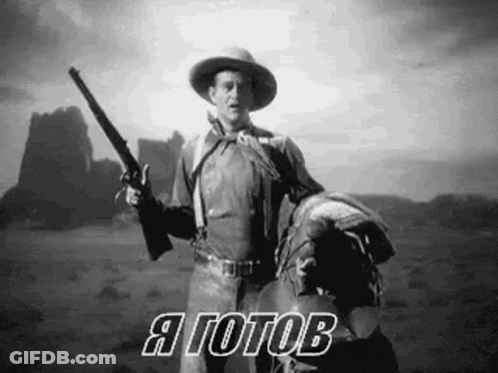 Cowboy Holding Gun On Horse In Desert GIF