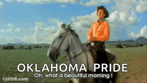 Cowboy Riding White Horse With Oklahoma Pride GIF