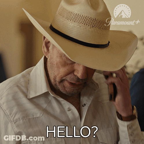 Cowboy Talking On Cell Phone Saying Hello GIF
