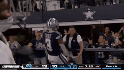 Cowboys Player Cooks Running Towards Fans GIF