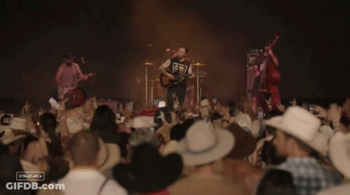 Cowboys Watching Band On Stage GIF