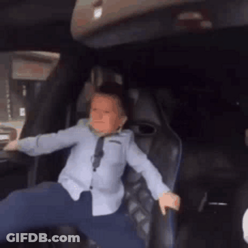 Crazy Driver And Young Boy Holding Tight GIF