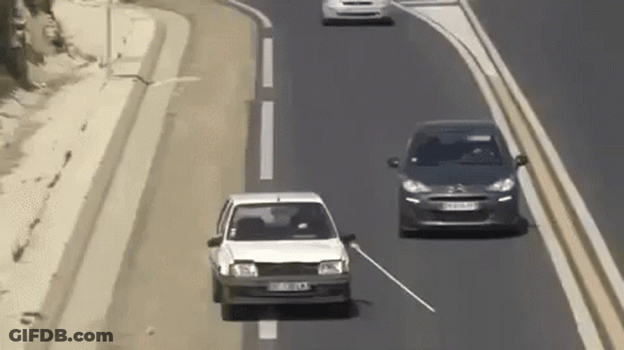 Crazy Driving Pulling Out A Long Stick GIF