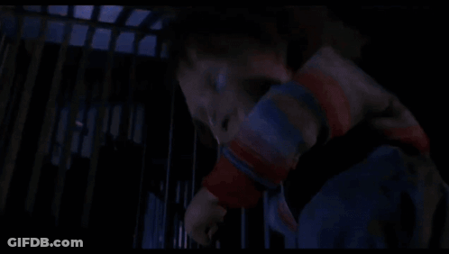 Creepy Doll In Crib With Blue Light GIF
