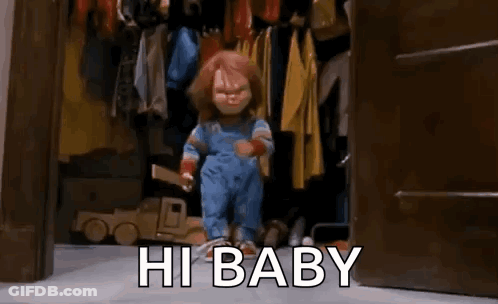 Creepy Doll Standing In Closet Saying Hi Baby GIF