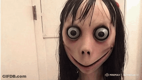 Creepy Doll With Big Eyes Smiling At Door GIF