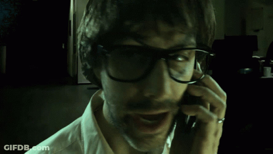 Creepy Guy Talking To His Phone GIF