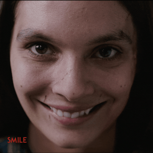 Creepy Smile Caitlin Stasey GIF