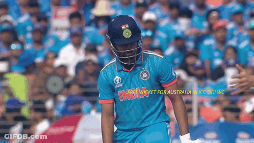 Cricket Player In Blue India Jersey In Front Of Crowd GIF