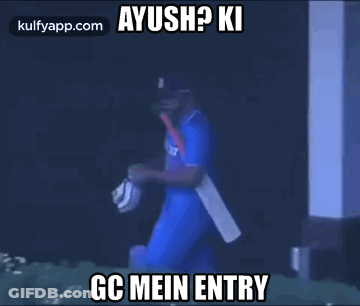 Cricket Player Walking In Dark Room With Bat And Mask GIF