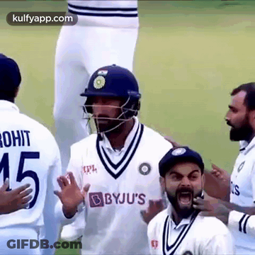 Cricket Players On Field One Wearing Helmet GIF