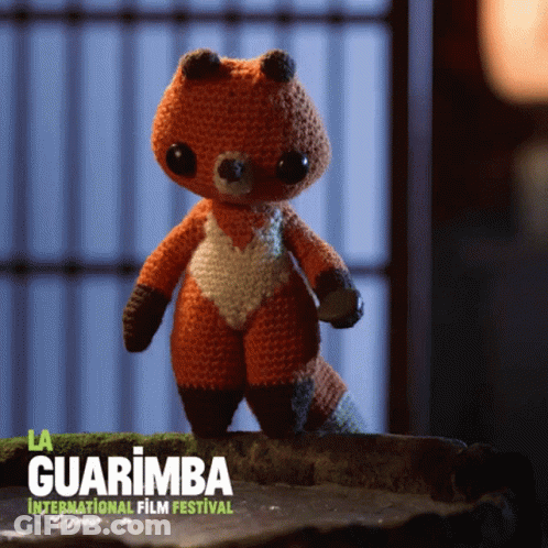 Crocheted Fox Standing On Rock GIF