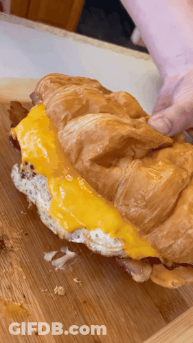 Croissant Sandwich With Cheese And Bacon GIF
