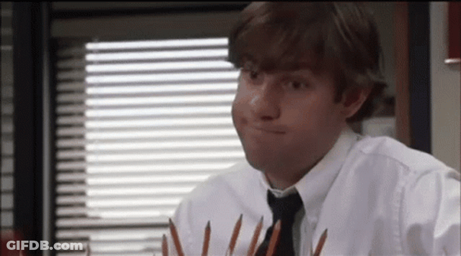 Cross Fingers Forced Smile GIF