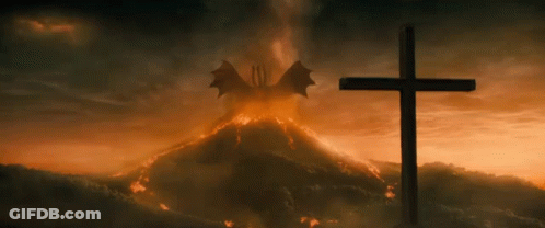 Cross In Front Of Volcano With Dragon Flying GIF