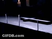 Cross On A Table In The Dark GIF