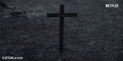 Cross With Regina Written In Dirt GIF