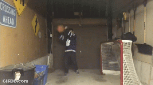 Crossing Ahead Sign Hanging In Garage GIF