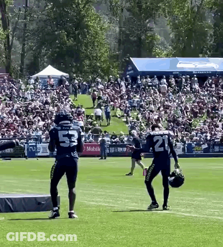 Crowd Around Bear Mascot Saying Go Bears GIF
