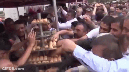 Crowd Around Bread Display GIF