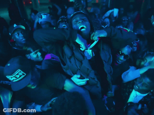Crowd Around Man In Black Hoodie GIF