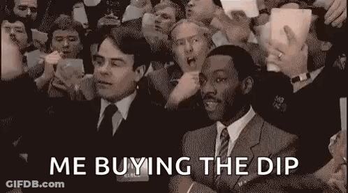 Crowd Around Man In Suit Holding Money GIF