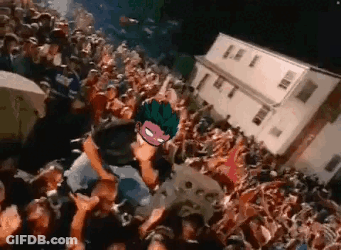 Crowd Around Stage With Masked Man GIF